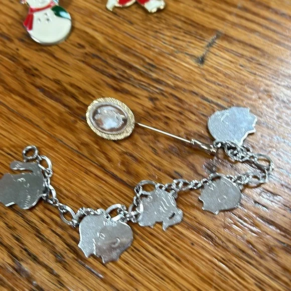 Assorted costume jewelry.  Includes 8 pieces. Seven pins and 1 bracelet. - Picture 10 of 10